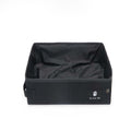 Collapsible cat litter box folded flat into compact travel bag