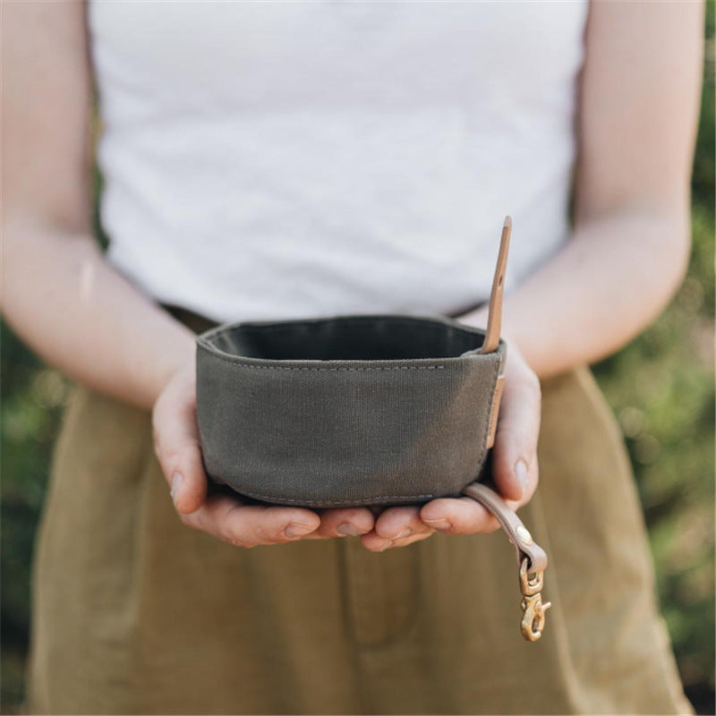 Waterproof dog bowl in grey color folded for travel
