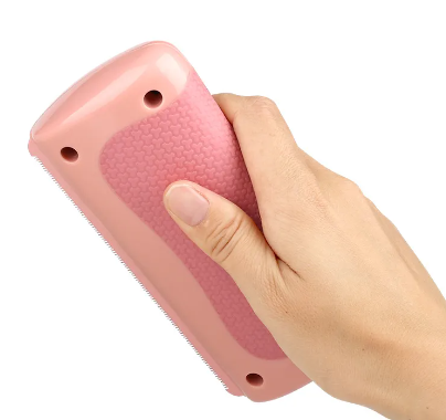 Pet hair scraper black showing collected fur after use